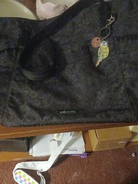 Sakroots Black Floral-Patterned Tote with Colorful Parrot Charm